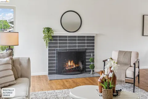 a living room with furniture a pool table and a fireplace