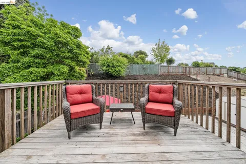 a view of roof deck with furniture