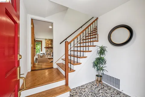 a view of entryway with wooden floor