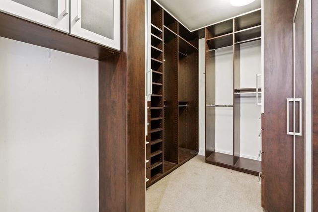 a view of closet area with empty racks