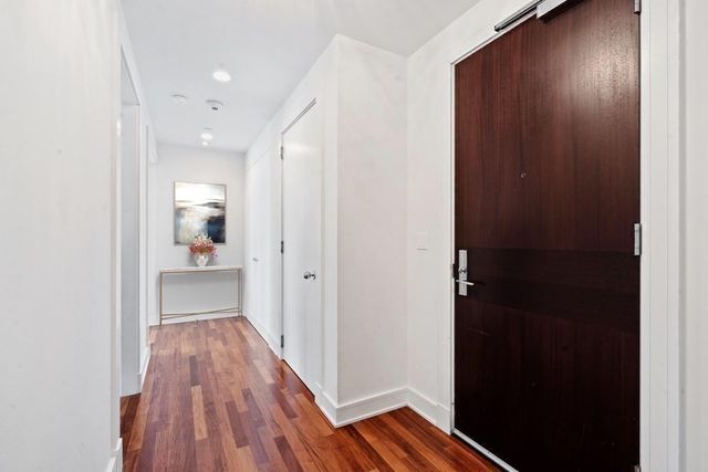 a bathroom with a sink and glass door
