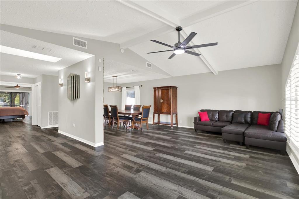 7487 River Country Drive Weeki Wachee, FL 34607 - Photo 8 of 53 a living room with furniture and wooden floor