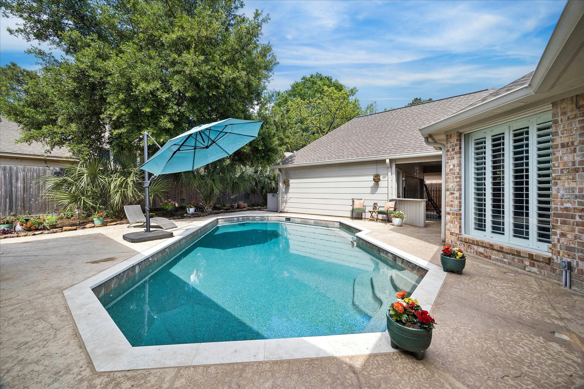 2810 Timber Country Way Kingwood, TX 77345 - Photo 30 of 30 a view of a patio with swimming pool table and chairs