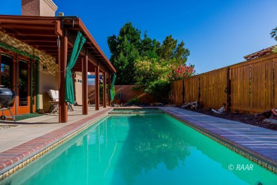 643 North Rio Bravo Street Ridgecrest, CA 93555 - Photo 26 of 29 a view of a backyard with plants and a patio