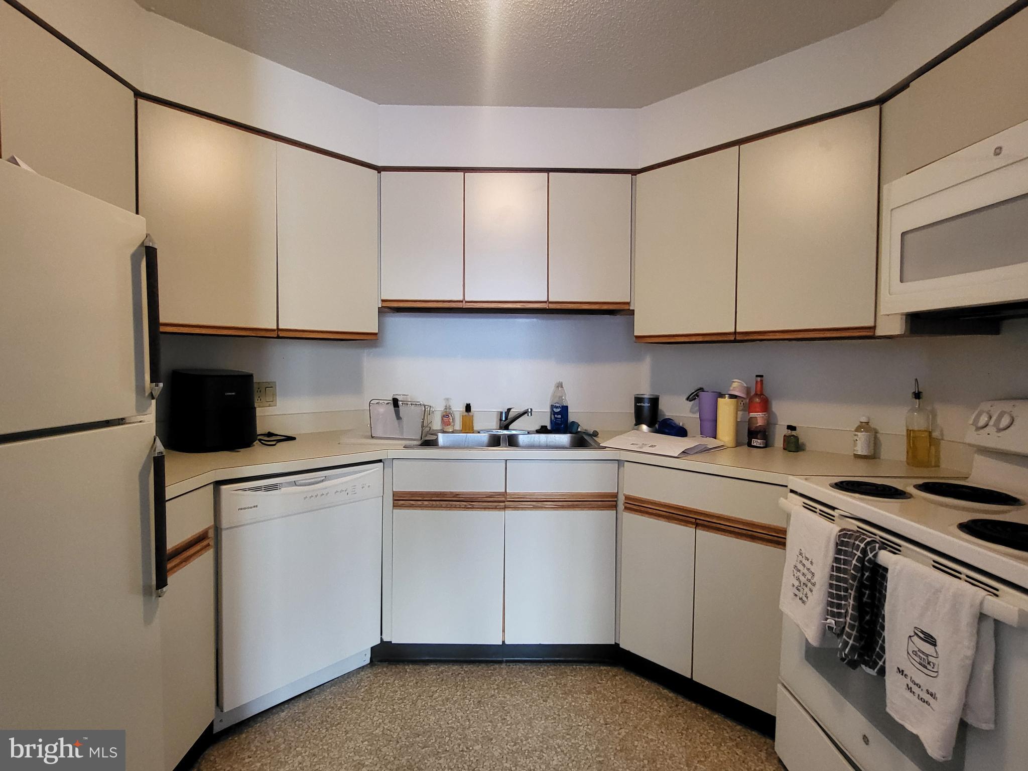 2020 Walnut Street, Unit 8K Philadelphia, PA 19103 - Photo 3 of 19 a kitchen with cabinets appliances a sink and a counter top