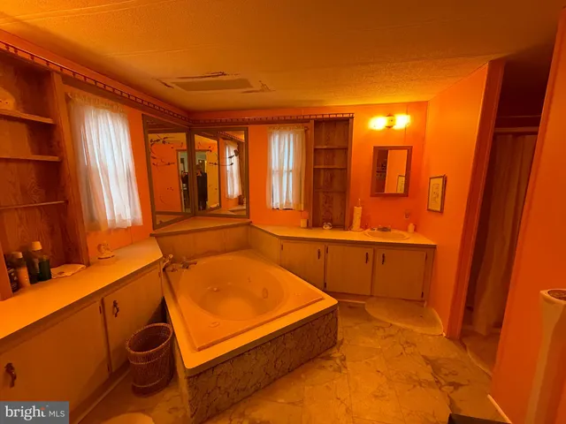 a bathroom with a tub and sink