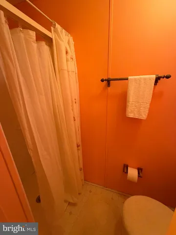 a bathroom with a shower curtain