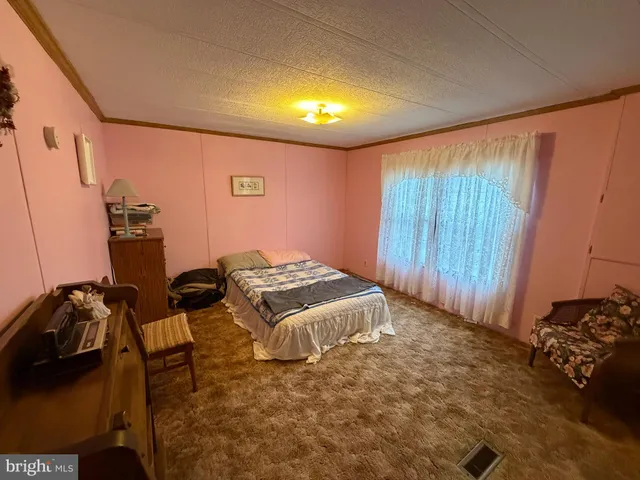 a bedroom with a bed and a closet