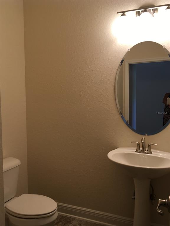 4380 Southwest 92nd Pl Road Ocala, FL 34476 - Photo 27 of 57 a bathroom with a sink toilet and mirror