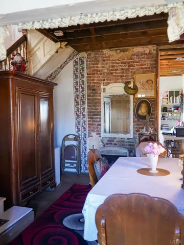 a front view of a house with seating space