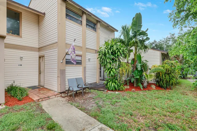 a view of a back yard of the house