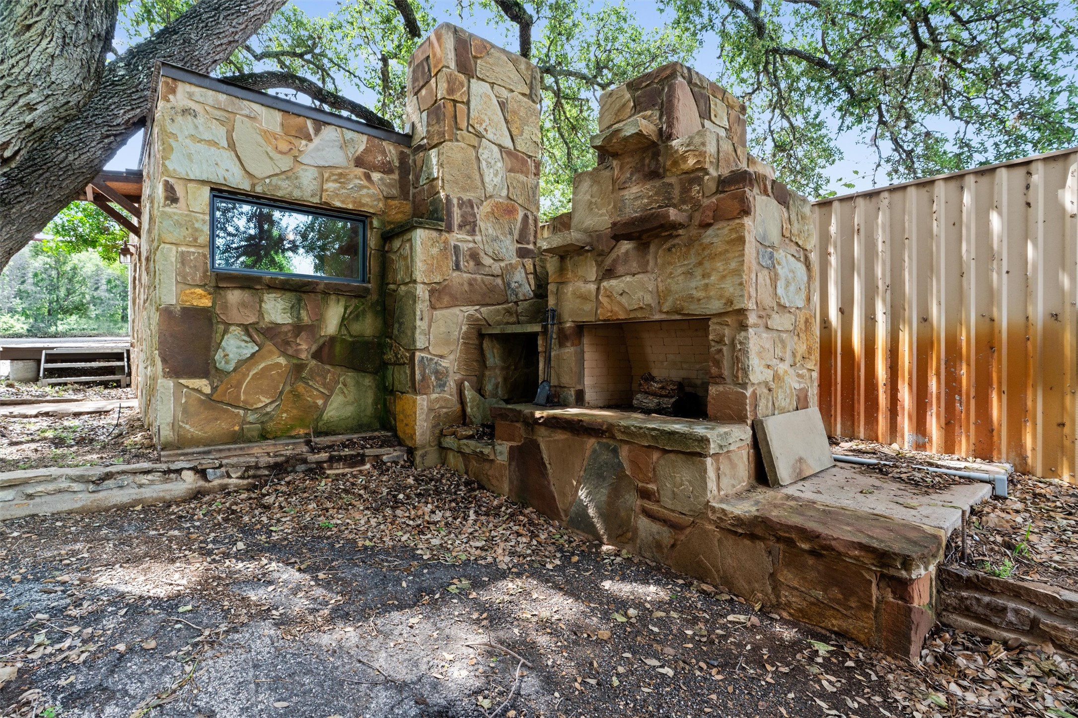 325 Eagle Rest Burnet, TX 78611 - Photo 23 of 40 An impressive outdoor fireplace constructed from natural stone creates a rustic focal point in the yard.