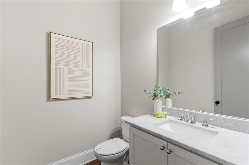 2736 Pangborn Road Decatur, GA 30033 - Photo 16 of 47 a bathroom with a granite countertop toilet sink and mirror