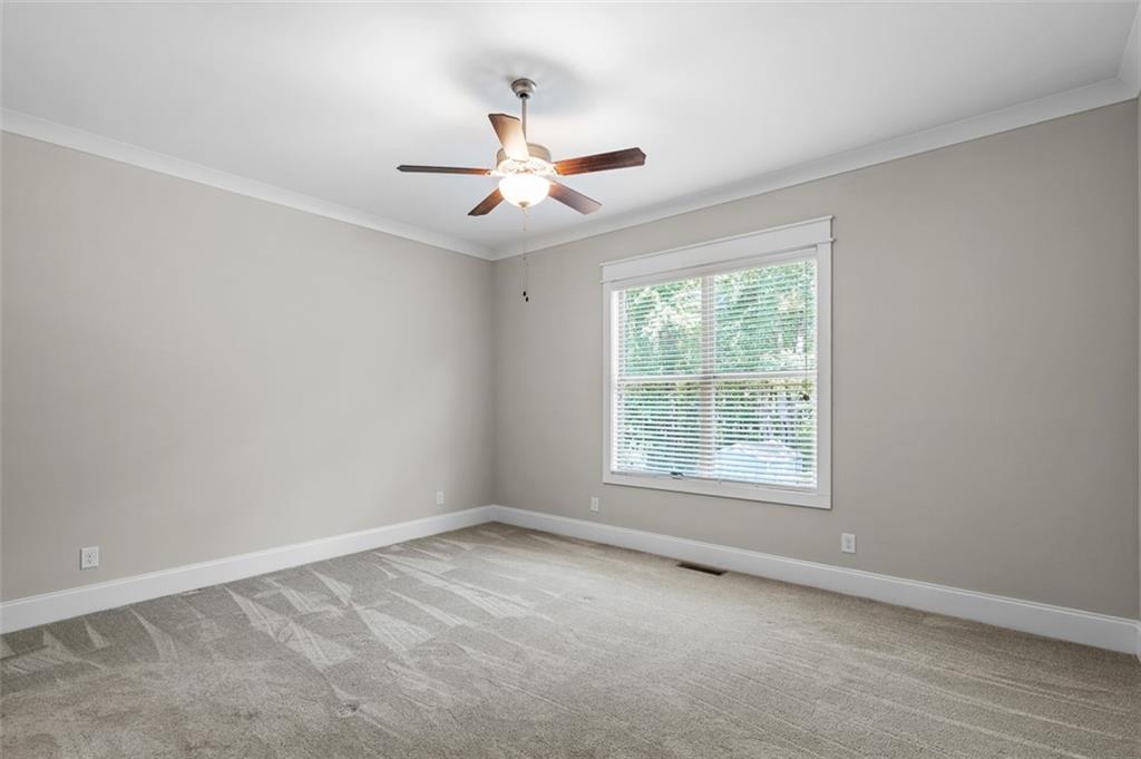 2736 Pangborn Road Decatur, GA 30033 - Photo 17 of 47 an empty room with a window and a fan