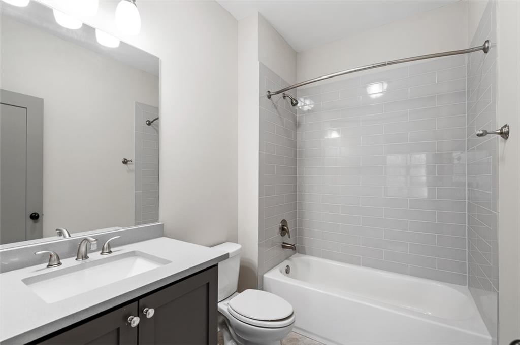 2736 Pangborn Road Decatur, GA 30033 - Photo 27 of 47 a bathroom with a granite countertop sink toilet and shower