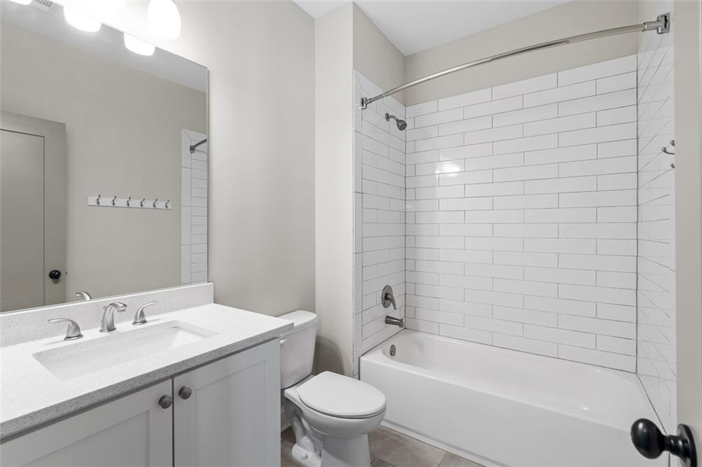 2736 Pangborn Road Decatur, GA 30033 - Photo 29 of 47 a bathroom with a sink a toilet and shower