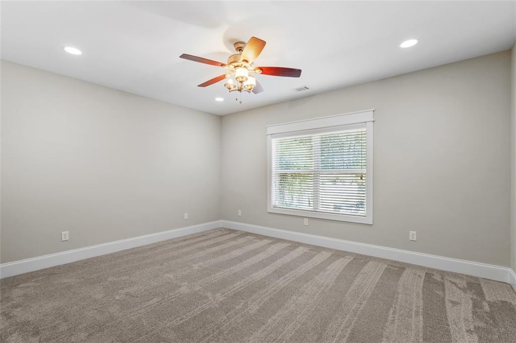 2736 Pangborn Road Decatur, GA 30033 - Photo 35 of 47 an empty room with a window and a fan