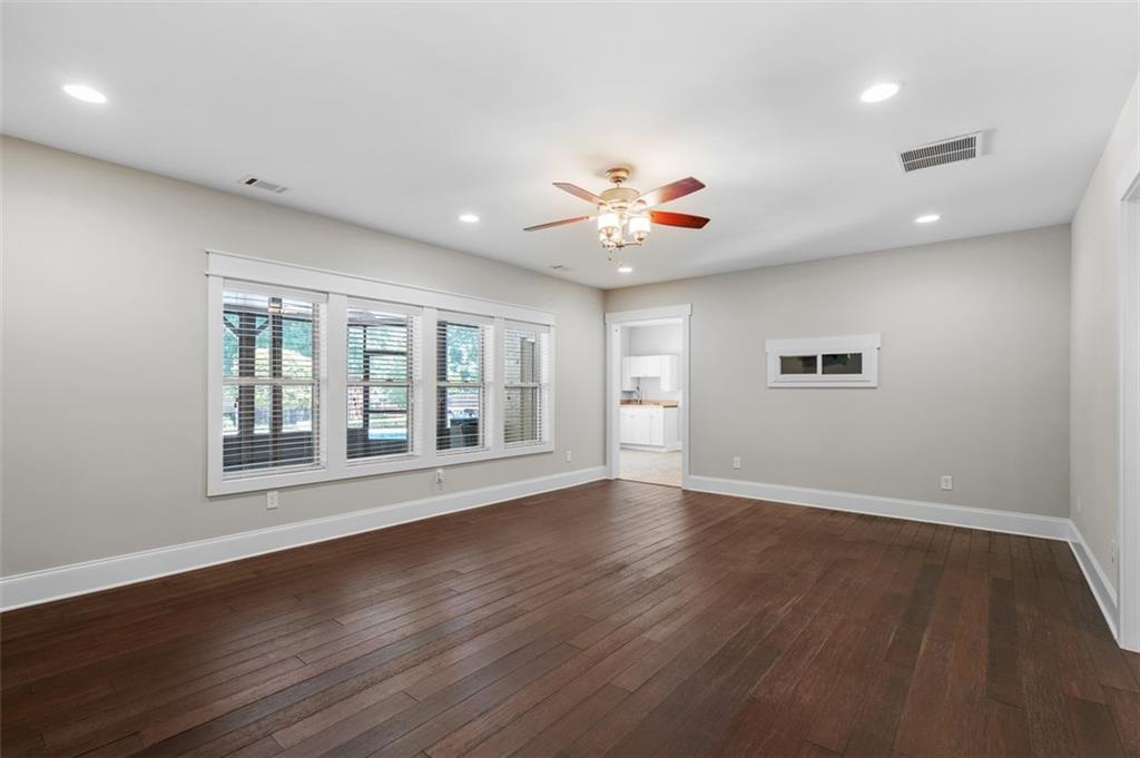 2736 Pangborn Road Decatur, GA 30033 - Photo 37 of 47 a view of an empty room with a window and wooden floor