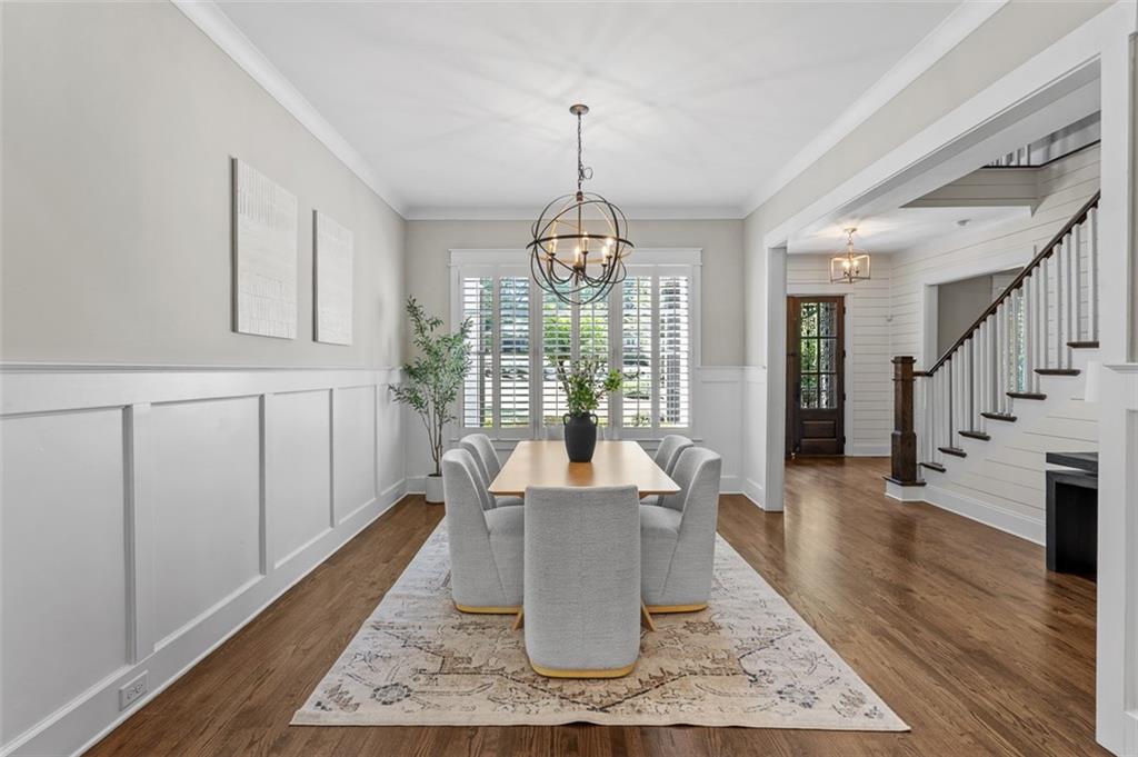 2736 Pangborn Road Decatur, GA 30033 - Photo 6 of 47 a living room with furniture a chandelier and a wooden floor