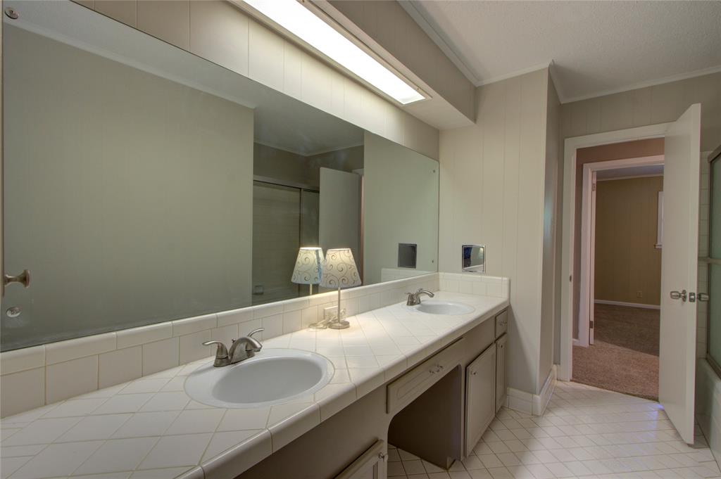 4207 Hazel Street Texarkana, TX 75503 - Photo 13 of 30 a bathroom with a sink and a mirror
