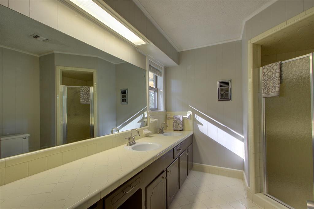 4207 Hazel Street Texarkana, TX 75503 - Photo 17 of 30 a bathroom with a sink and a mirror