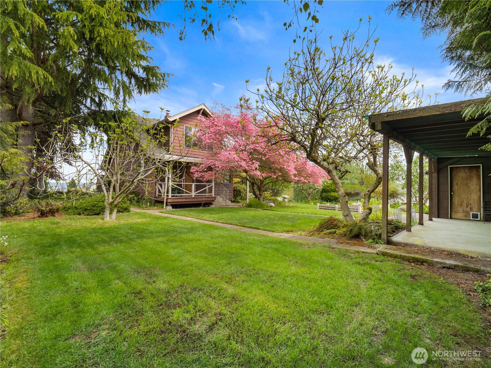 5704 North Ruby Street Tacoma, WA 98407 - Photo 31 of 38 a view of a house with a back yard