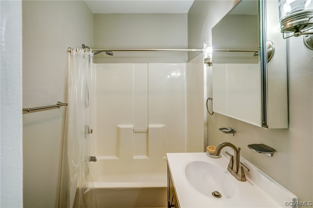 4306 Britannia Road Richmond, VA 23234 - Photo 12 of 20 a bathroom with a sink and a mirror