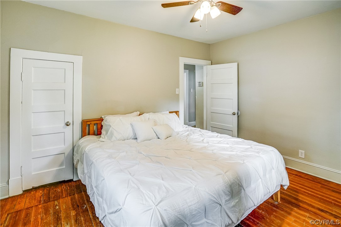 4306 Britannia Road Richmond, VA 23234 - Photo 16 of 20 a bedroom with a bed and a chandelier