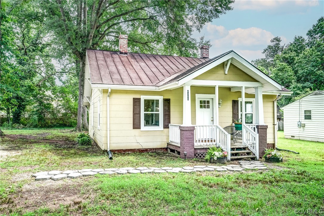 4306 Britannia Road Richmond, VA 23234 - Photo 19 of 20 a front view of house with yard outdoor seating and barbeque oven