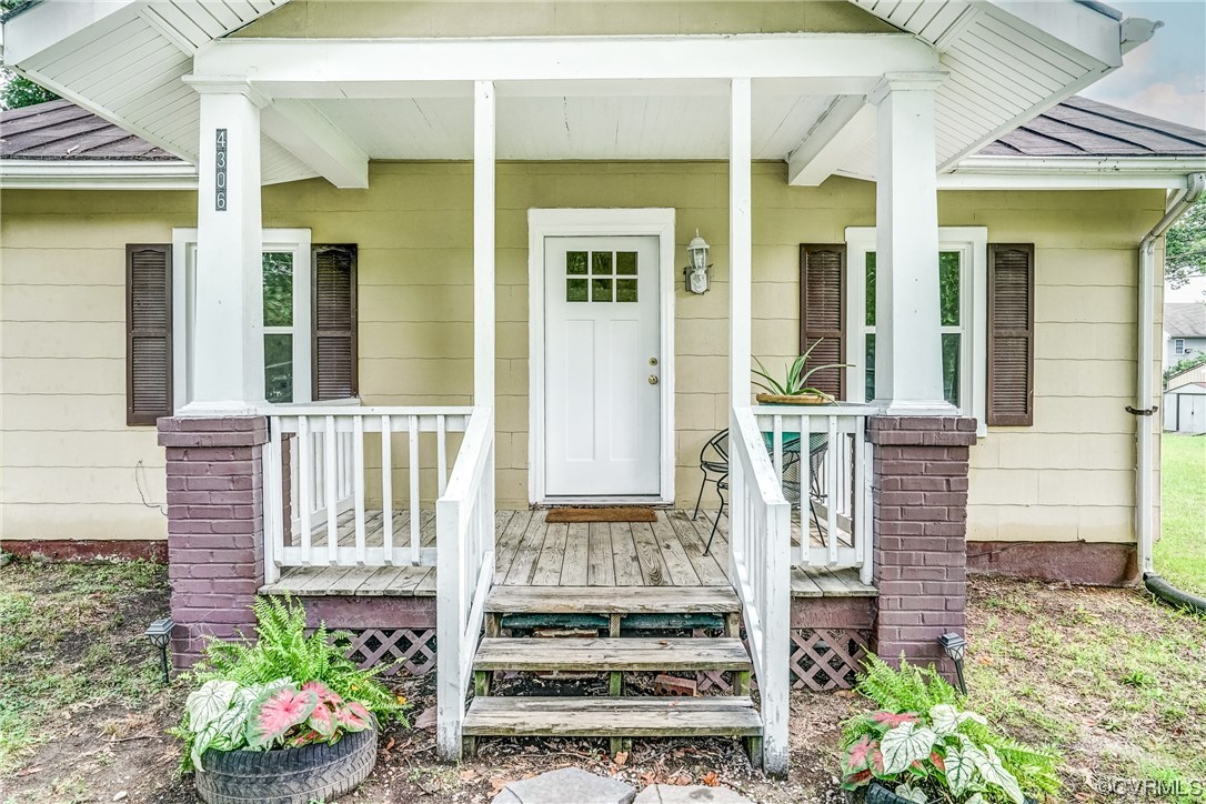 4306 Britannia Road Richmond, VA 23234 - Photo 3 of 20 front view of a house with a potted plant