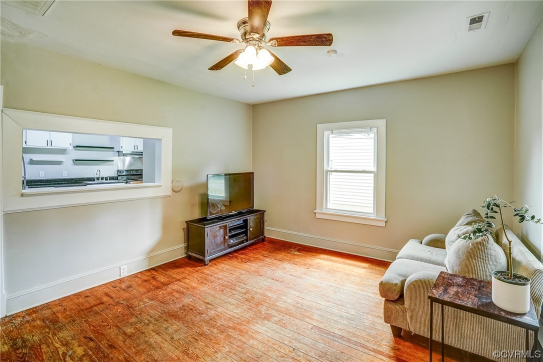4306 Britannia Road Richmond, VA 23234 - Photo 4 of 20 a living room with furniture and a flat screen tv