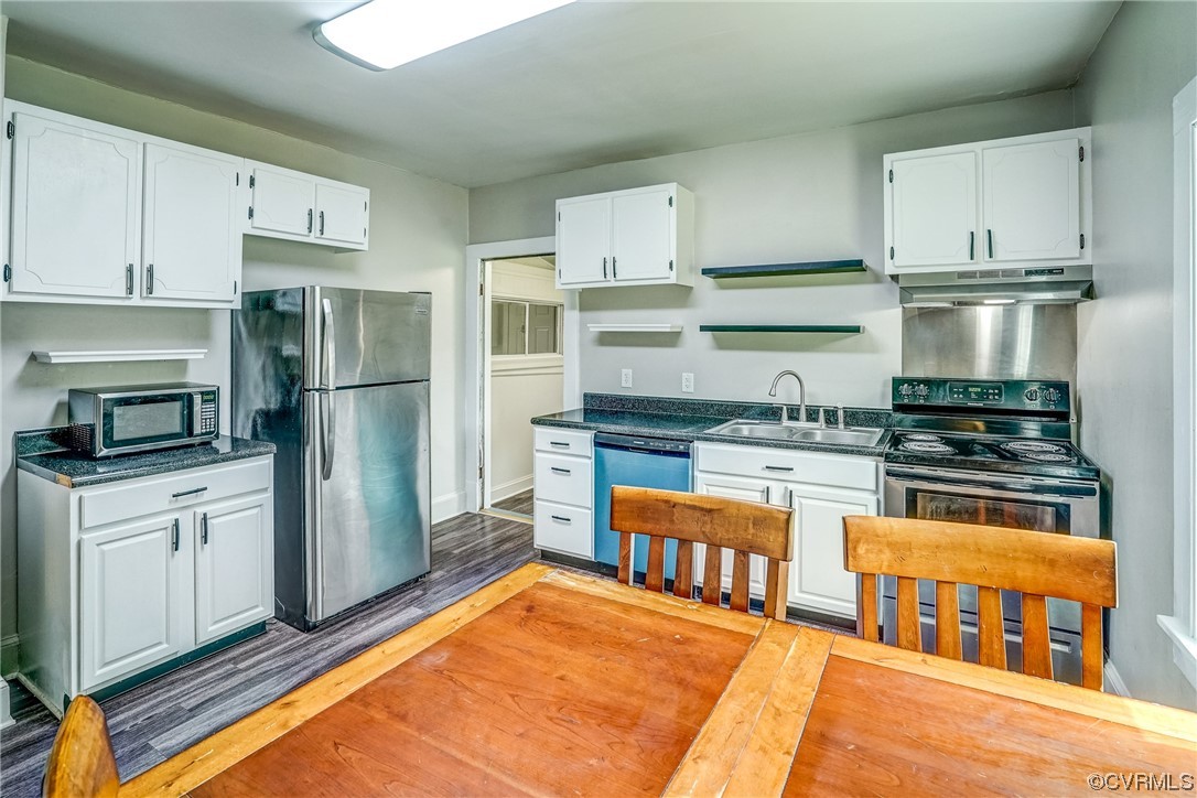 4306 Britannia Road Richmond, VA 23234 - Photo 8 of 20 a kitchen with stainless steel appliances granite countertop a refrigerator and stove top oven