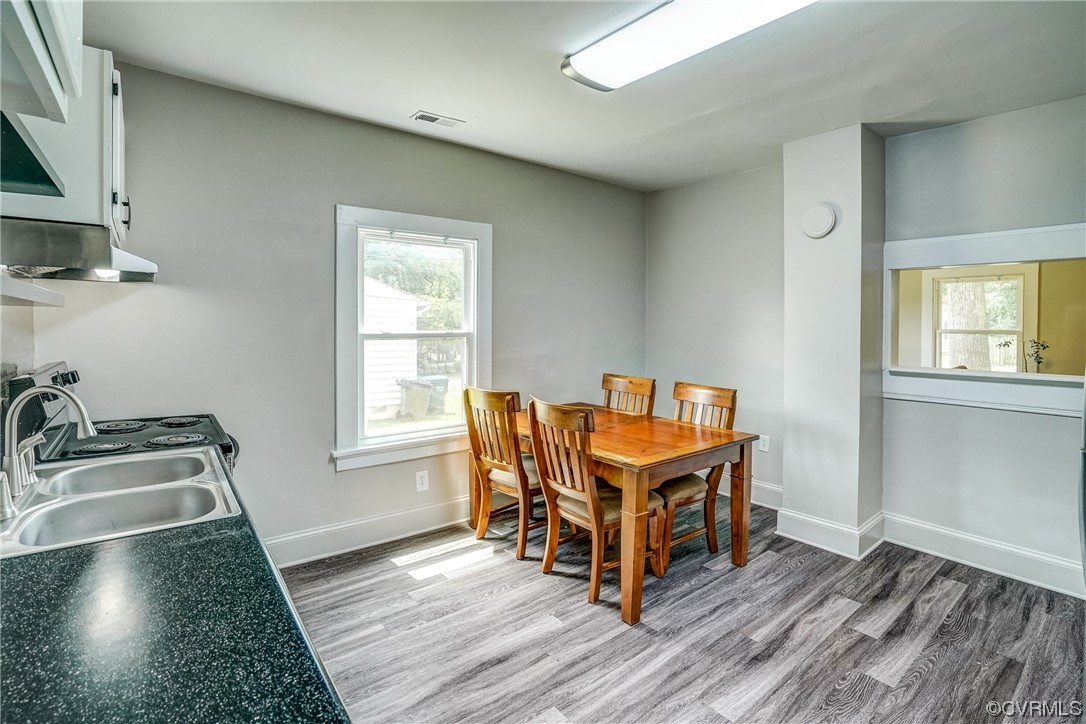 4306 Britannia Road Richmond, VA 23234 - Photo 10 of 20 a room with furniture and a wooden floor