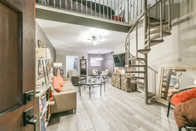 a view of a livingroom with furniture and a couch