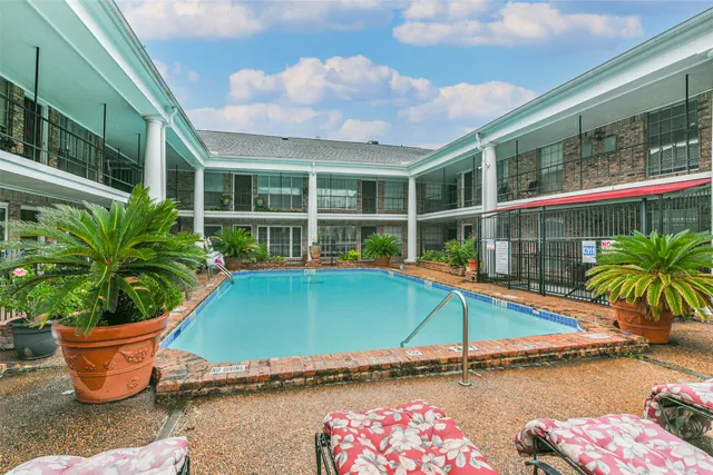 a house with swimming pool in front of it