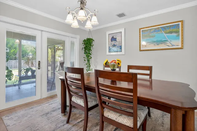 a kitchen with stainless steel appliances granite countertop a sink a stove and a wooden cabinets