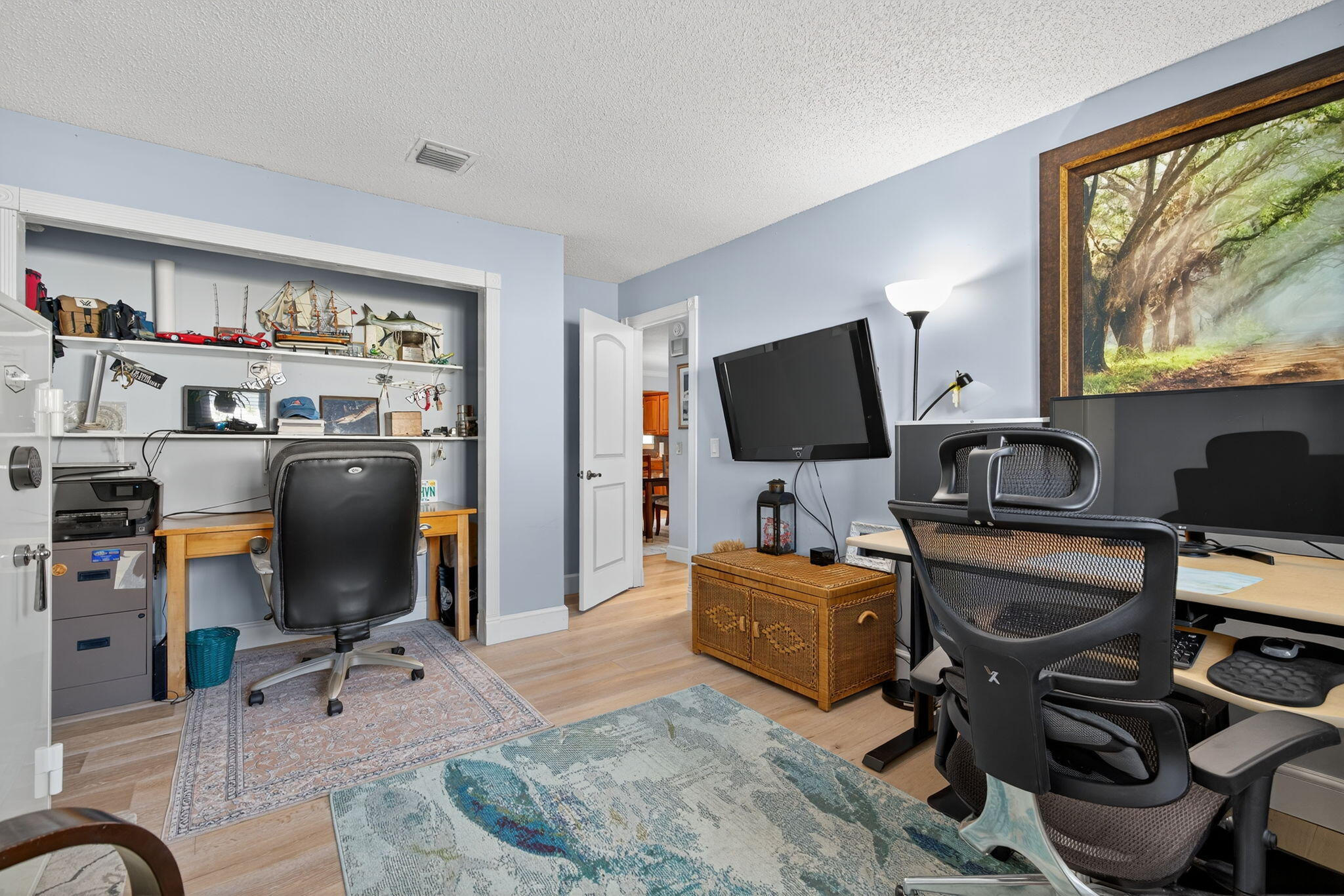 5095 Southeast Manatee Terrace Stuart, FL 34997 - Photo 29 of 58 a view of a workspace with furniture and a window