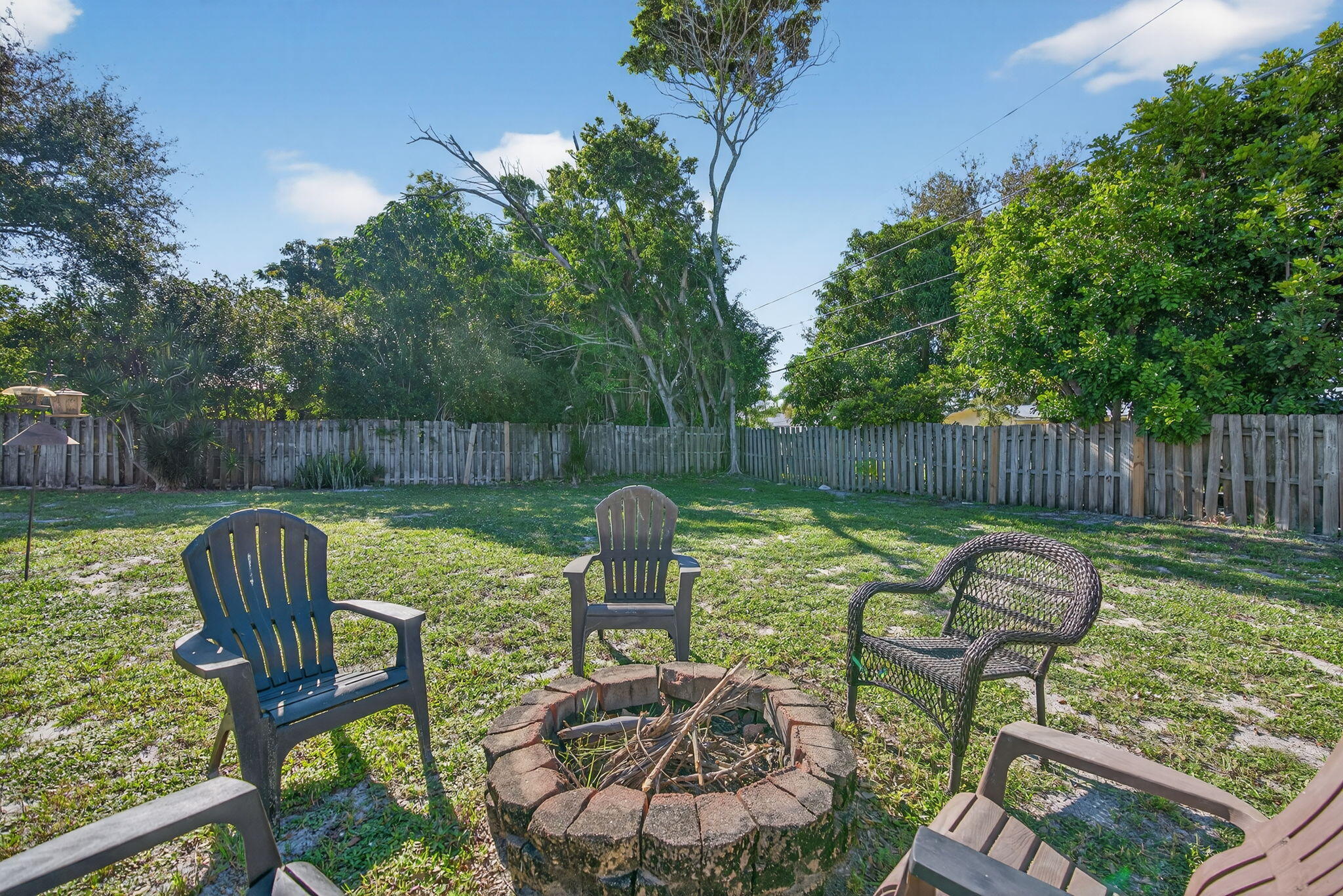 5095 Southeast Manatee Terrace Stuart, FL 34997 - Photo 41 of 58 a view of a chair and table in the patio