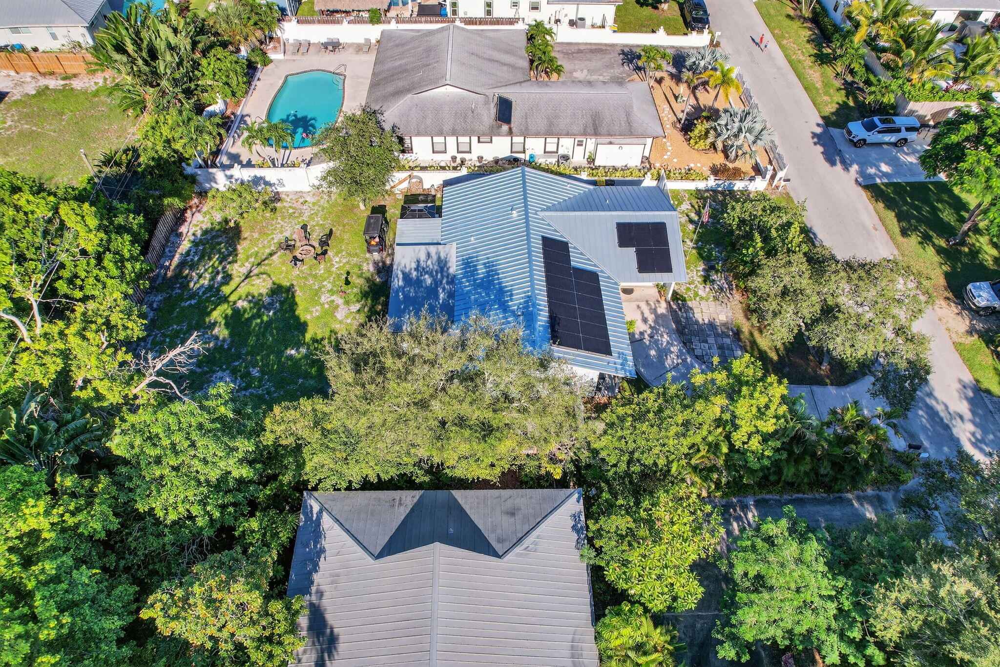 5095 Southeast Manatee Terrace Stuart, FL 34997 - Photo 55 of 58 an aerial view of a house with a yard and garden