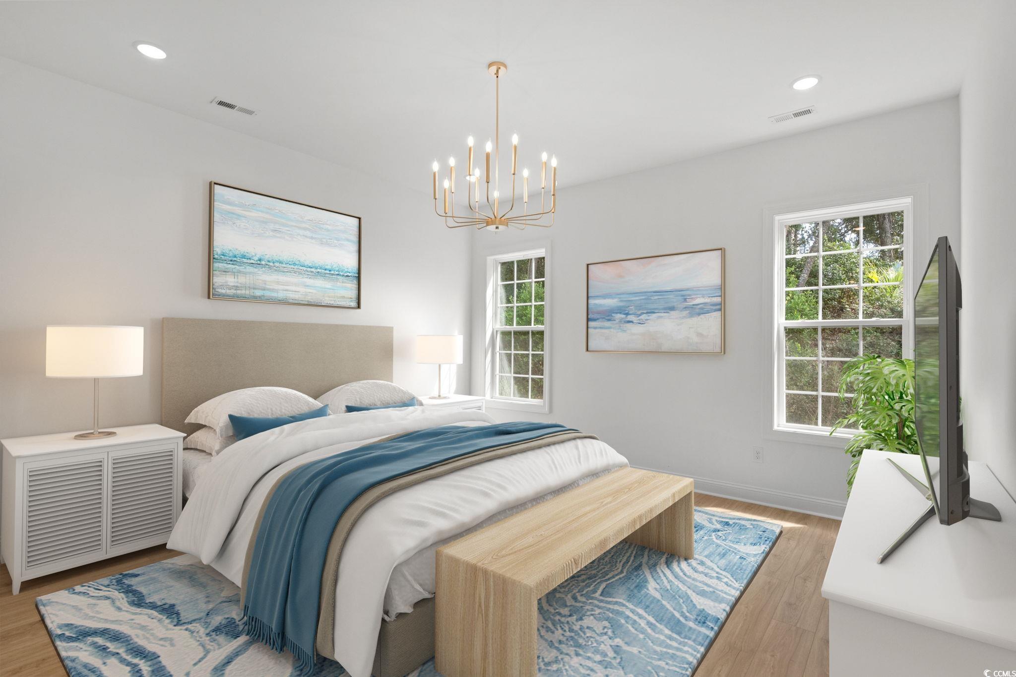 2247 Sand Dunes Drive Myrtle Beach, SC 29577 - Photo 17 of 40 Bedroom with light wood-type flooring, multiple windows, recessed lighting, and a chandelier