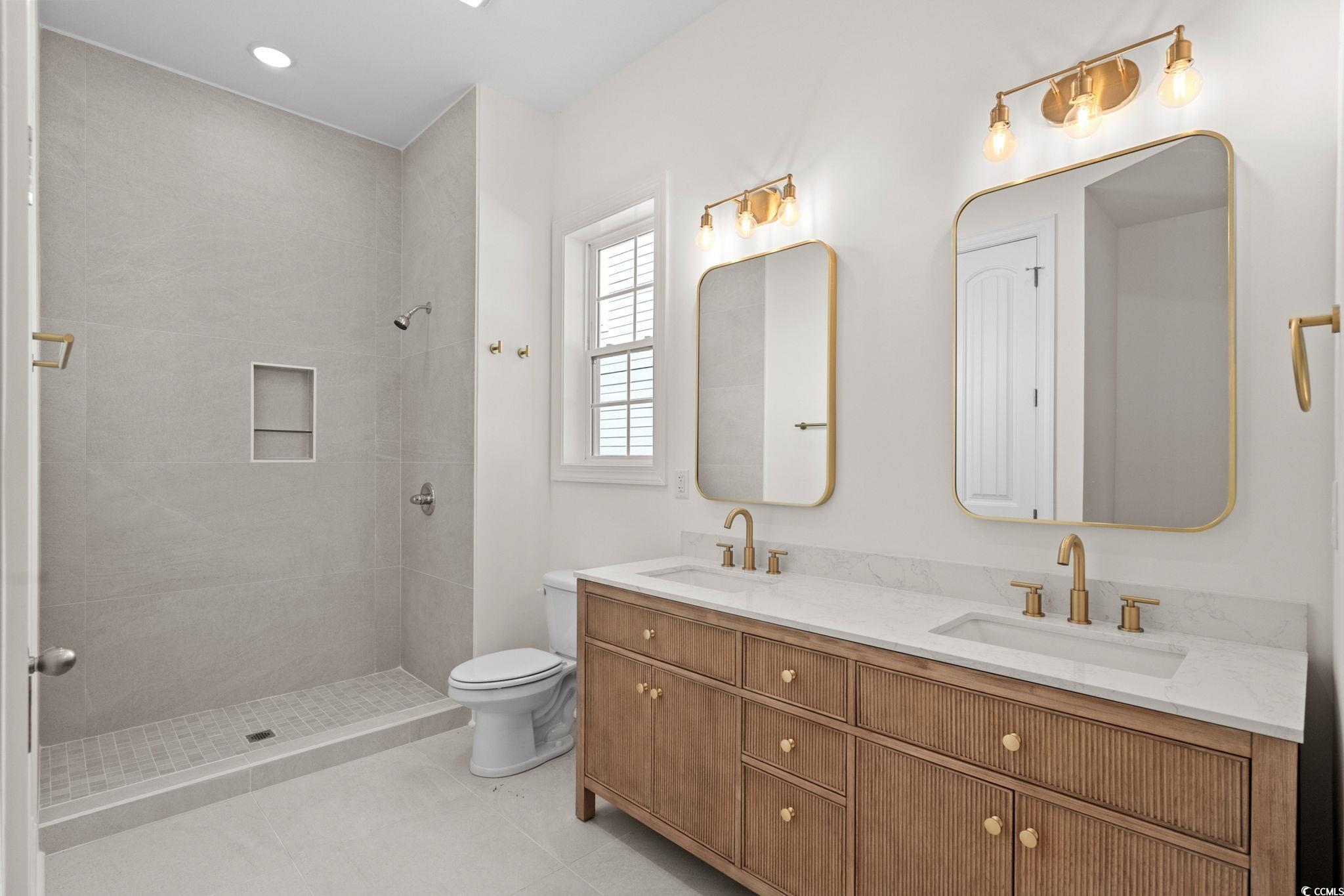 2247 Sand Dunes Drive Myrtle Beach, SC 29577 - Photo 19 of 40 Full bathroom with double vanity, a stall shower, light tile patterned floors, and recessed lighting