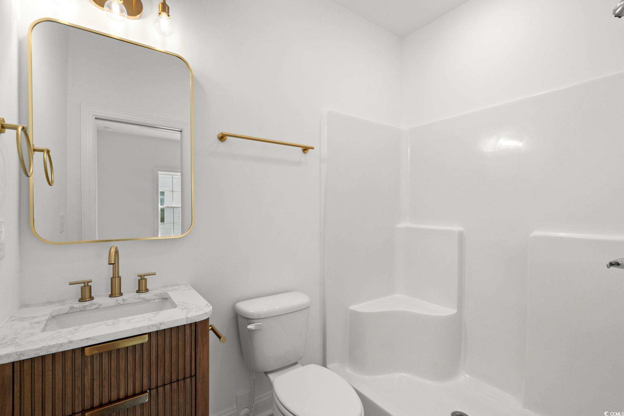 2247 Sand Dunes Drive Myrtle Beach, SC 29577 - Photo 25 of 40 Full bathroom featuring vanity and a shower