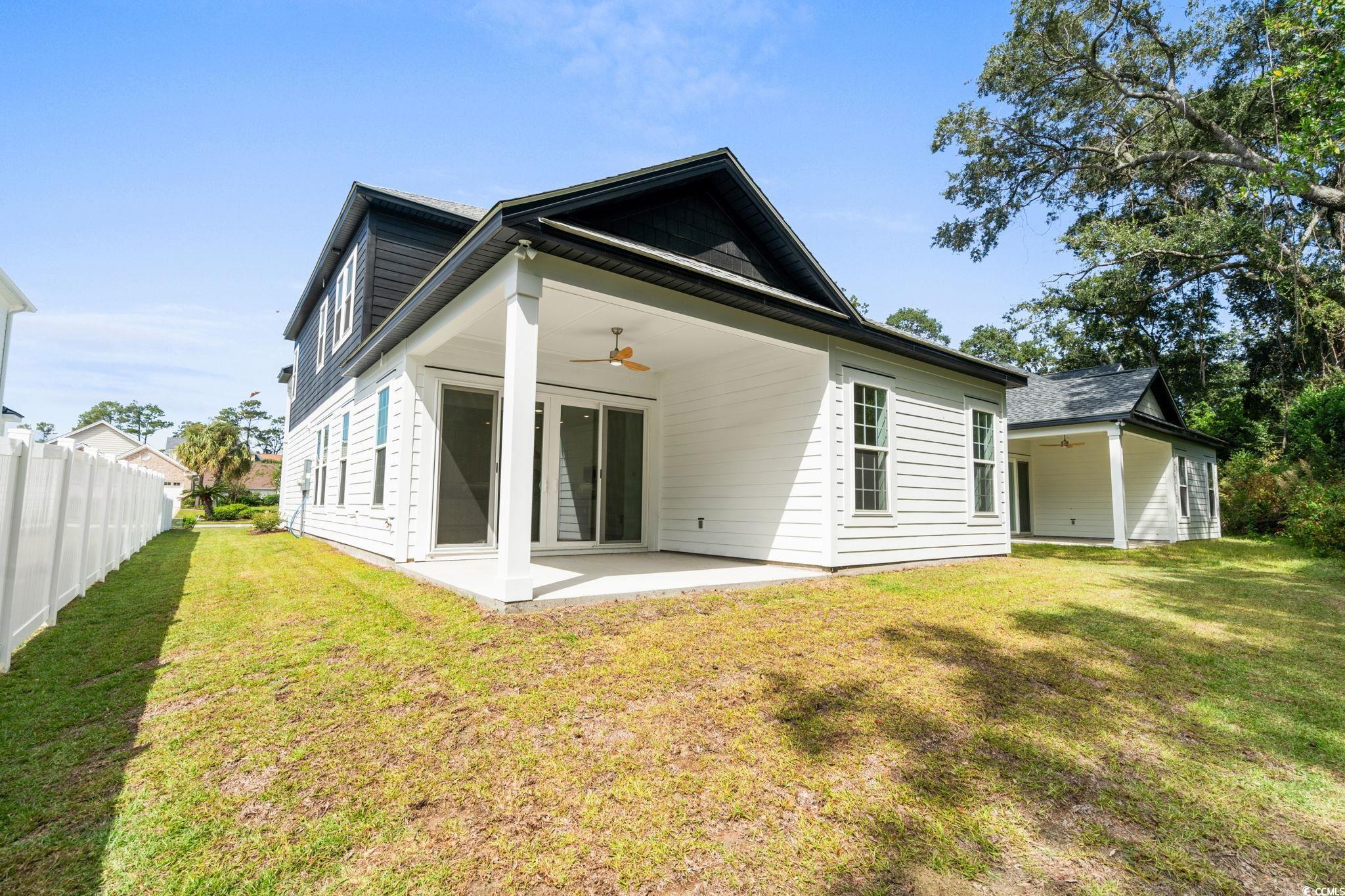2247 Sand Dunes Drive Myrtle Beach, SC 29577 - Photo 32 of 40 Rear view of property with ceiling fan and a patio