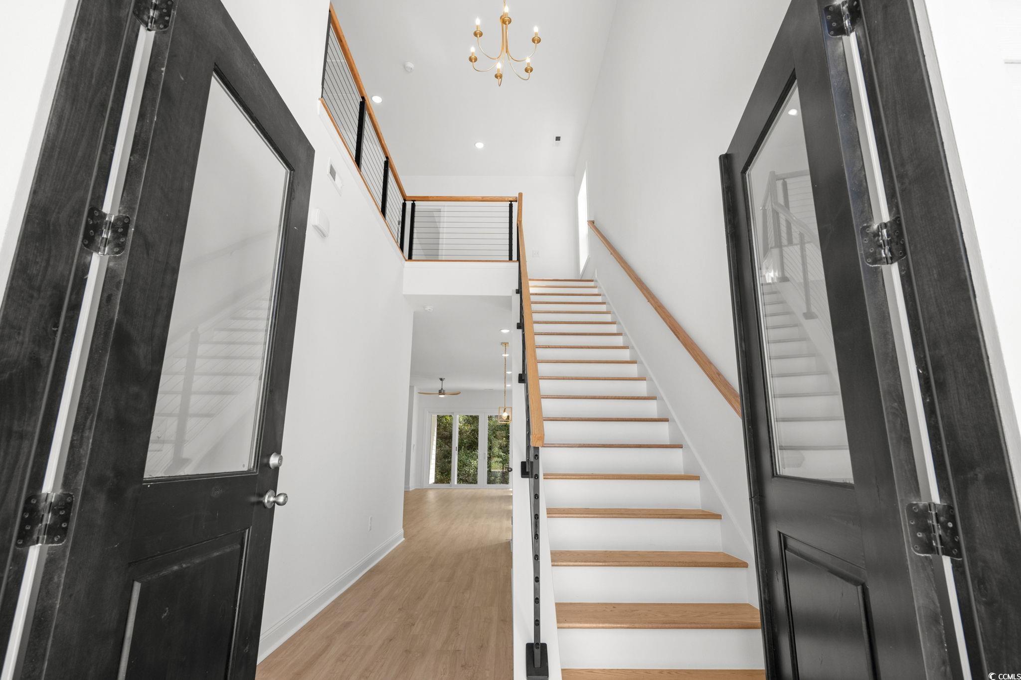 2247 Sand Dunes Drive Myrtle Beach, SC 29577 - Photo 4 of 40 Entrance foyer featuring stairs, a high ceiling, a chandelier, light wood-style flooring, and recessed lighting