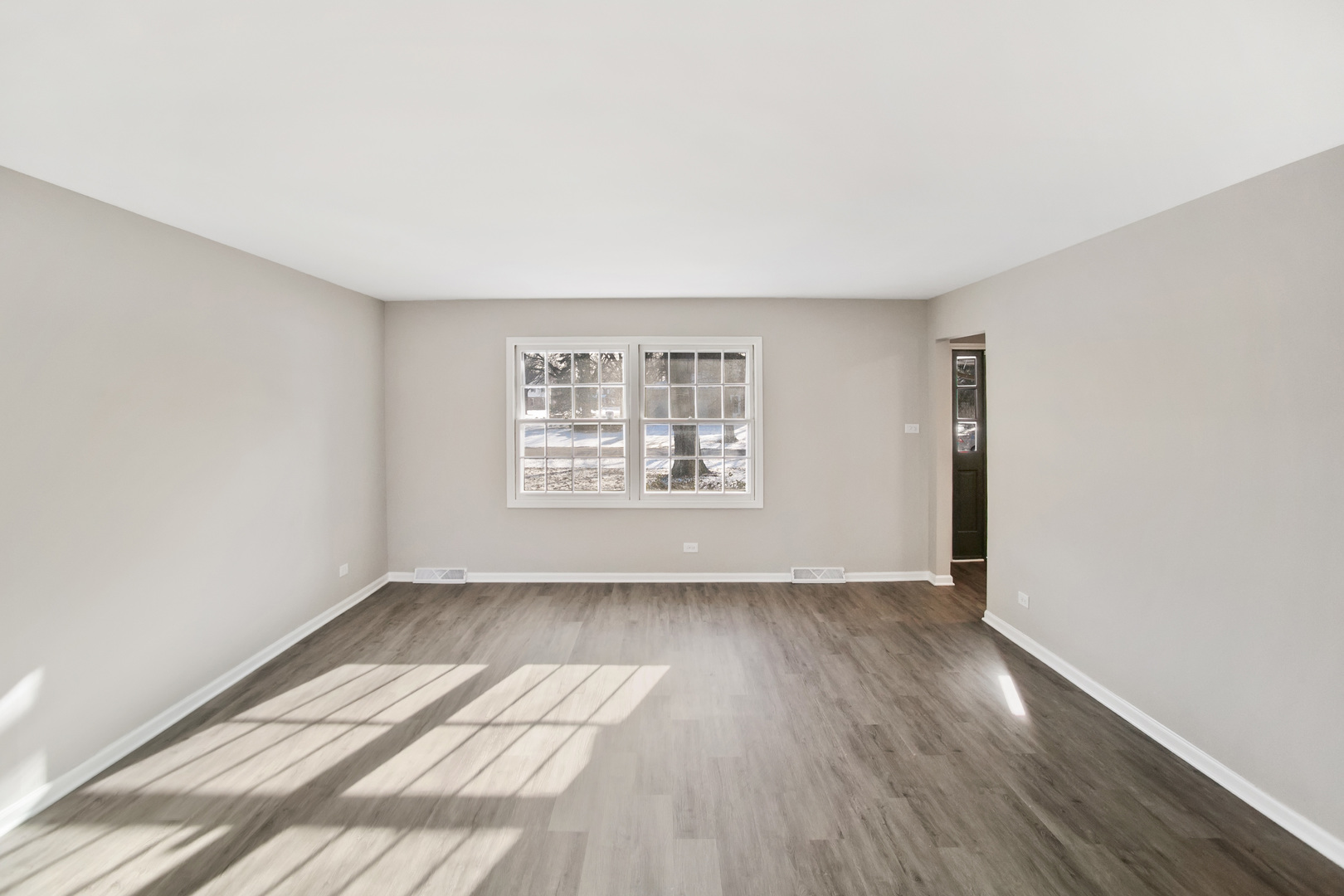 3451 Ithaca Road Olympia Fields, IL 60461 - Photo 4 of 29 an empty room with wooden floor and windows