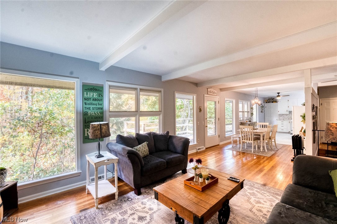 17064 Catsden Road Chagrin Falls, OH 44023 - Photo 5 of 16 Living room with ceiling fan, french doors, light hardwood / wood-style flooring, and beam ceiling