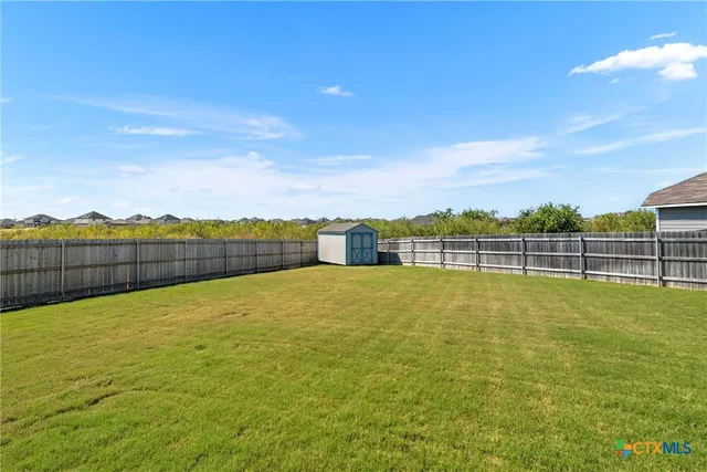 a view of a swimming pool with an ocean view