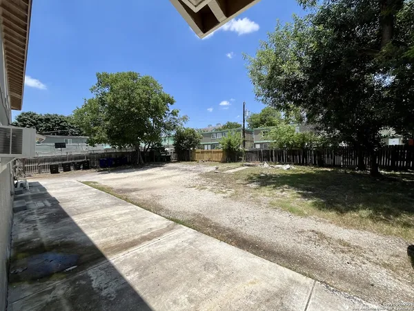 a view of backyard with outdoor space
