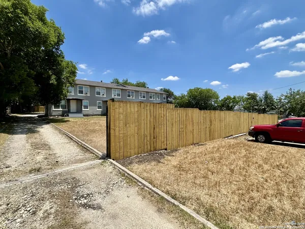 a view of a backyard of the house