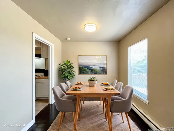 a view of a dining room with furniture window and wooden floor